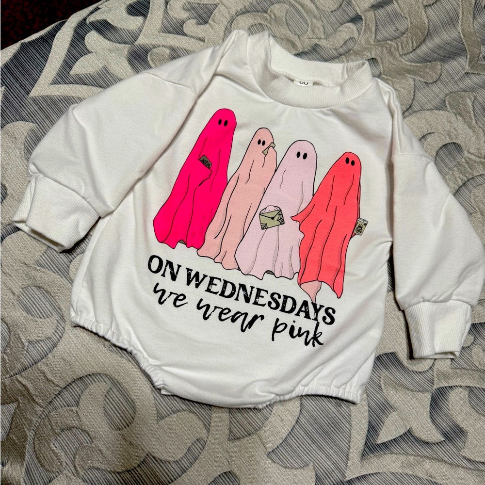 Baby girl, six months, long sleeve onesie